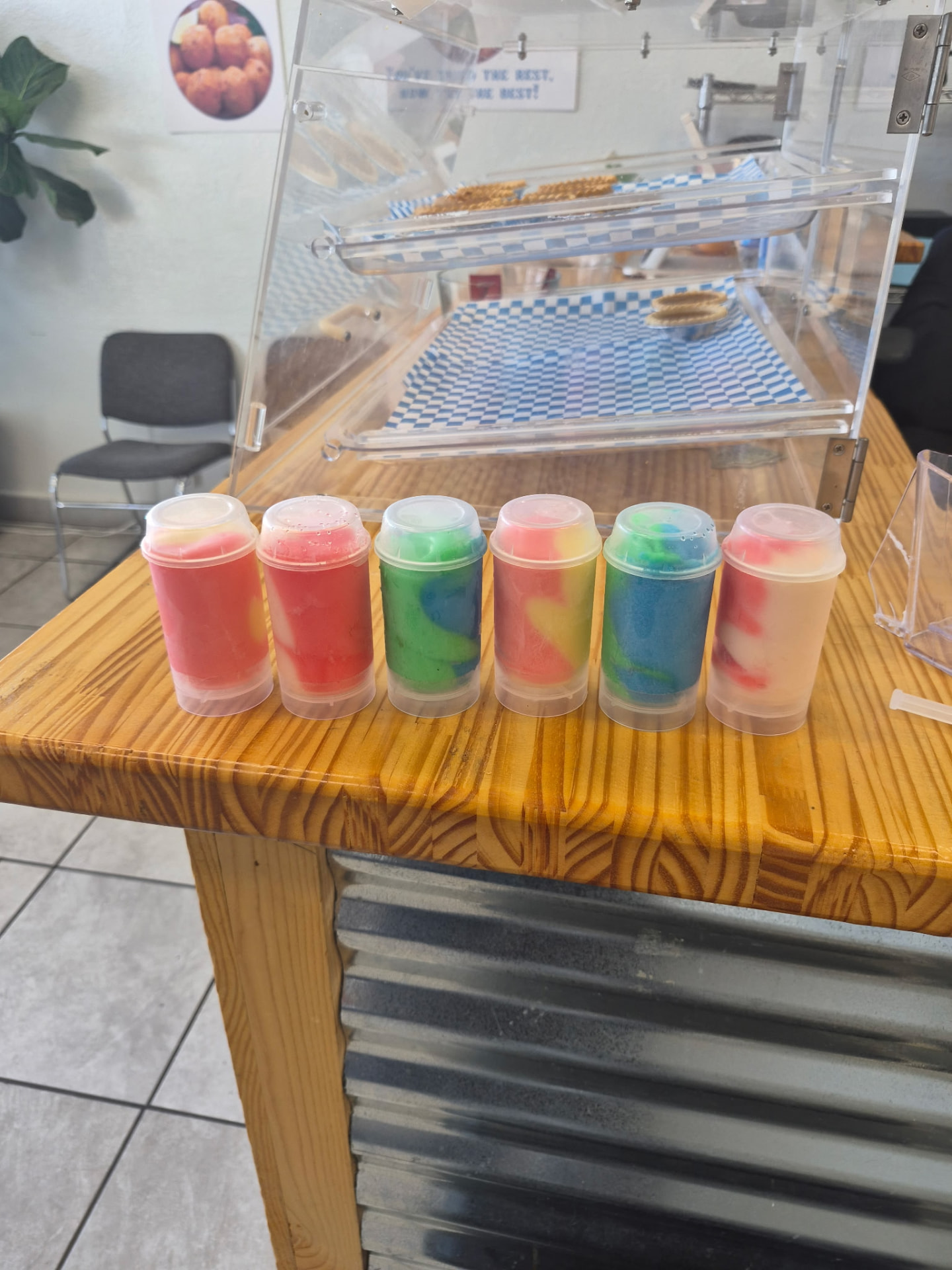 Colorful water ice cups on the counter